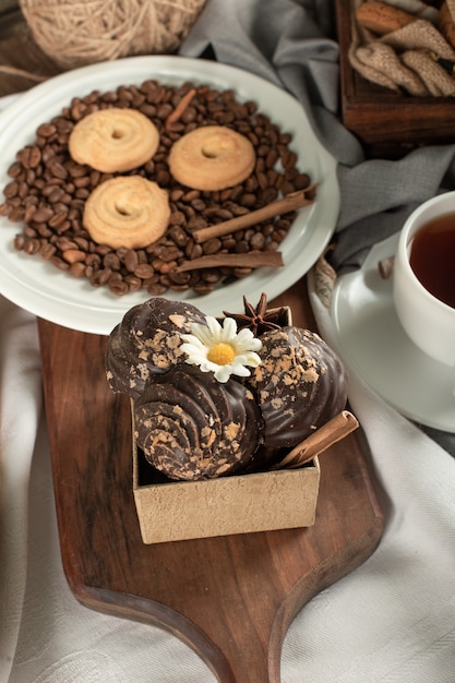 Coffee beans, cookies and chocolate pralines.