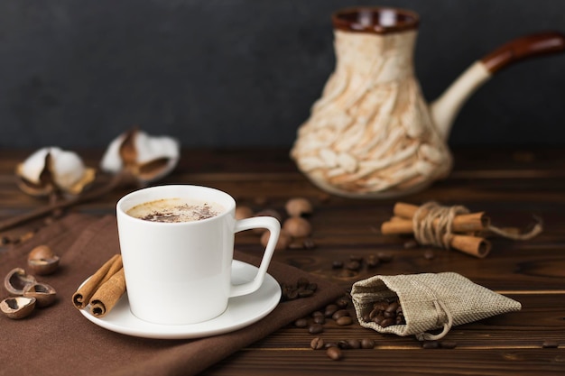 coffee beans in a cup on wooden table