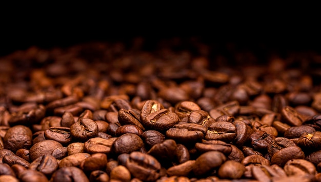 Coffee beans Dark background with copy space closeup