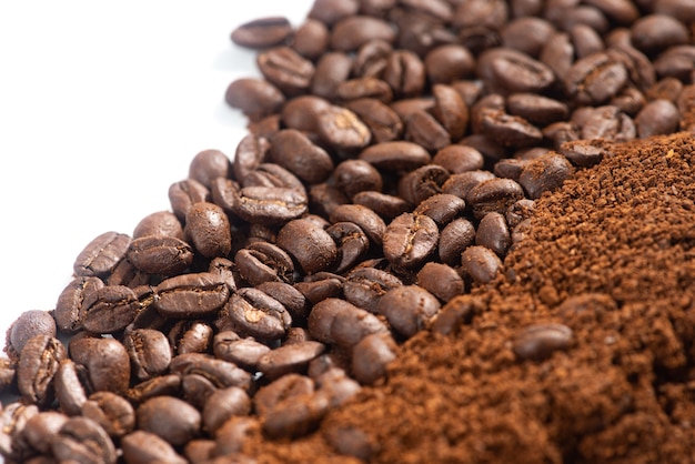 Coffee Beans and Grounds.Roasted coffee beans and grounds close up from above selective focused.