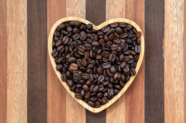 Coffee beans in heartshaped tray representing love of coffee