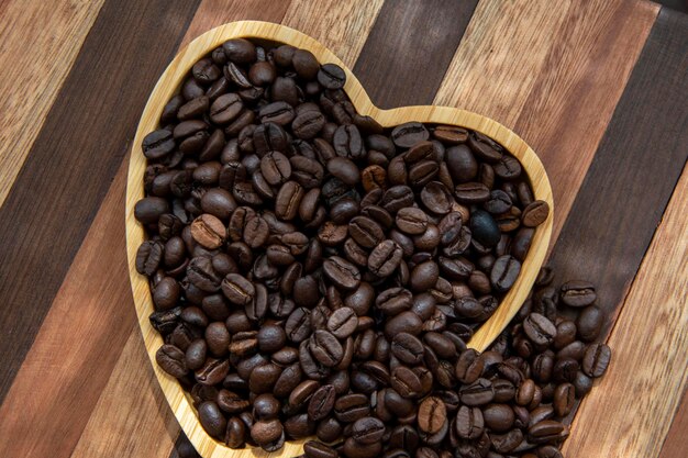 Coffee beans in heartshaped tray representing love of coffee