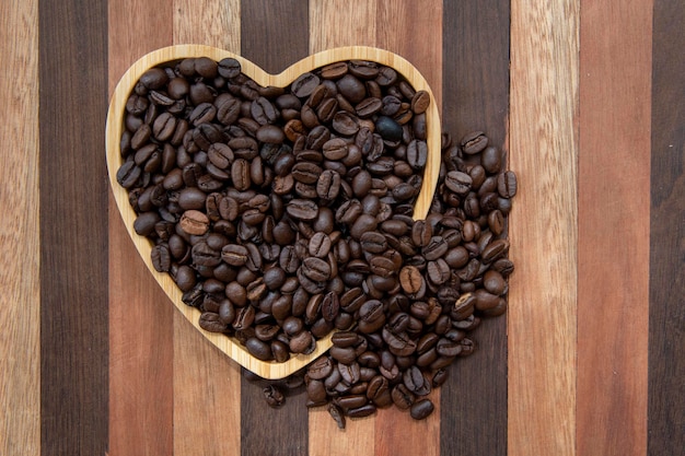 Coffee beans in heartshaped tray representing love of coffee