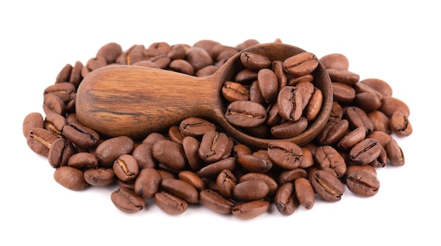 Coffee beans isolated on white background. Roasted arabica coffee beans in wooden spoon.