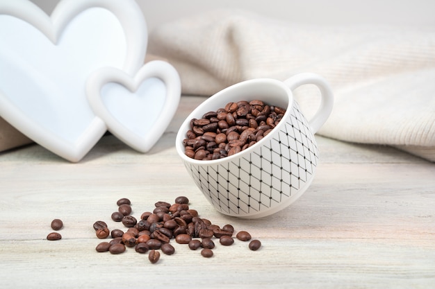 Coffee beans and levitating coffee Cup