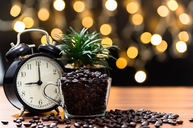 Coffee beans Placed on the desk Orange bokeh floor scene