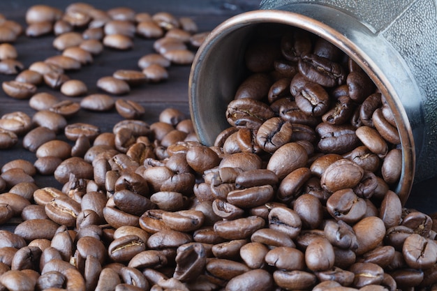 Coffee beans roasted isolated on wooden