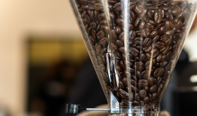 Coffee beans in roaster machine to make powder