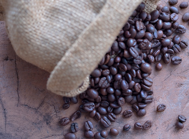 Coffee beans in the sack on the table