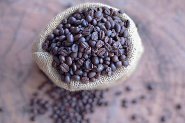 Coffee beans in the sack on the table