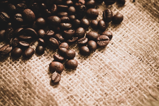 Coffee beans on sackcloth with copy space, Sepia tone