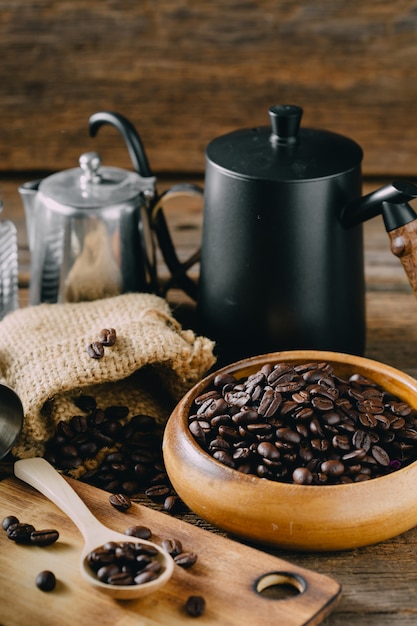 coffee beans with accessory drip coffee on wooden table 