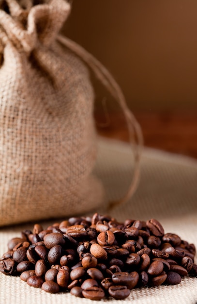 coffee beans, with raffia cloth bag