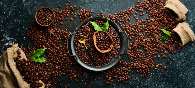 Coffee beans. On a wooden background. Top view. Copy space