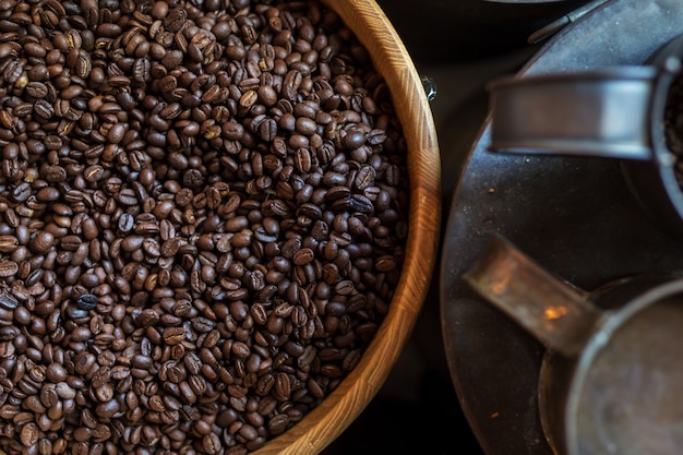 Coffee beans in wooden bowl