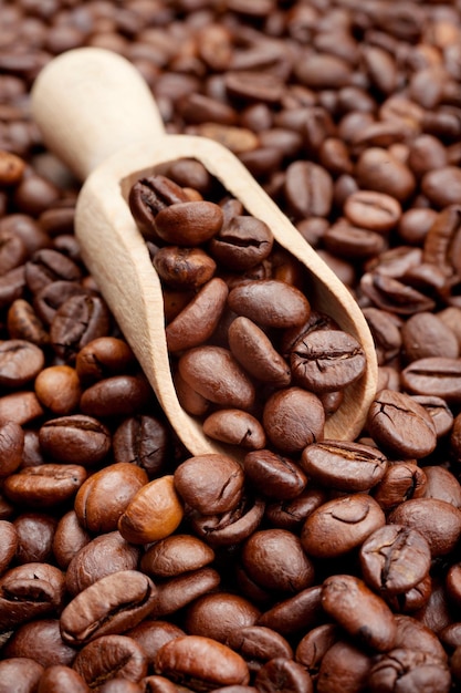 Coffee beans and wooden scoop