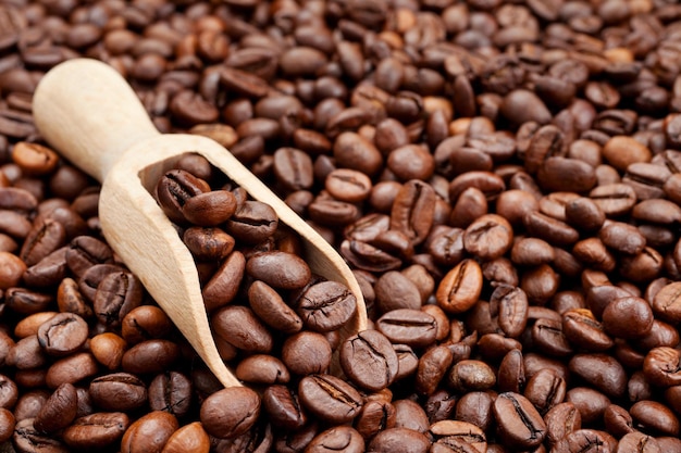 Coffee beans and wooden scoop