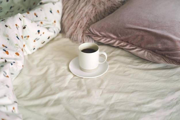 Coffee on the bed in the room Breakfast in a bed Cozy morning