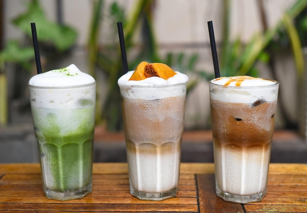 Coffee beverages with coffee beans on wooden table