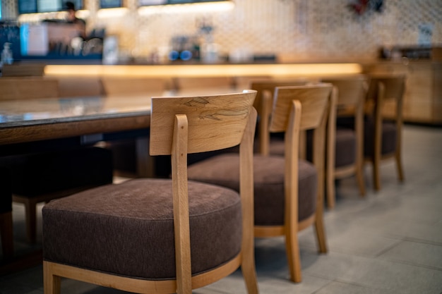 a coffee cafe with a wooden chair