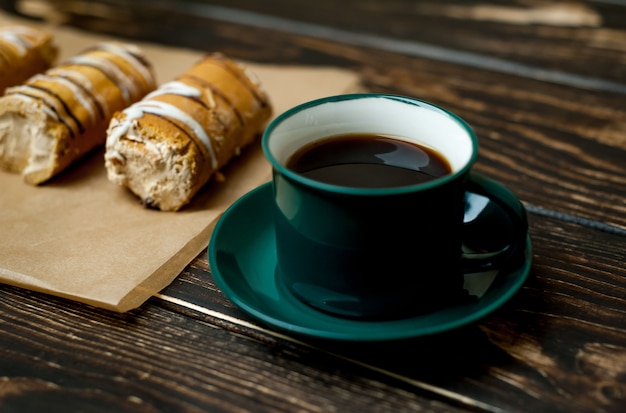 coffee and cake for breakfast on wood background