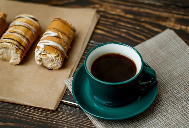 coffee and cake for breakfast on wood background