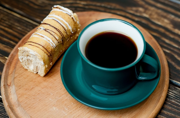 coffee and cake for breakfast on wood background