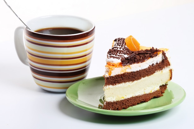 Coffee and cake over white