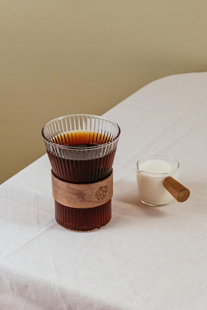 Coffee in a clear glass on the table