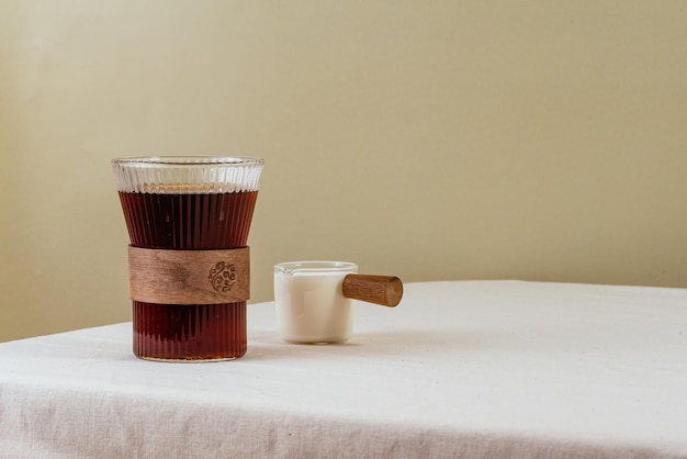 Coffee in a clear glass on the table