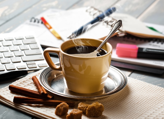 Coffee in a cup on the background of items for doing business