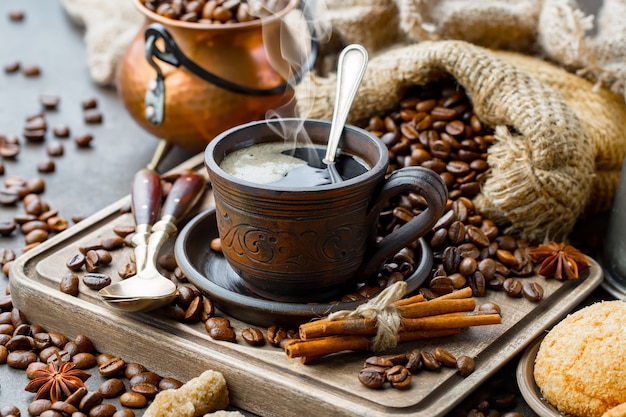 Coffee in a cup on coffee beans.