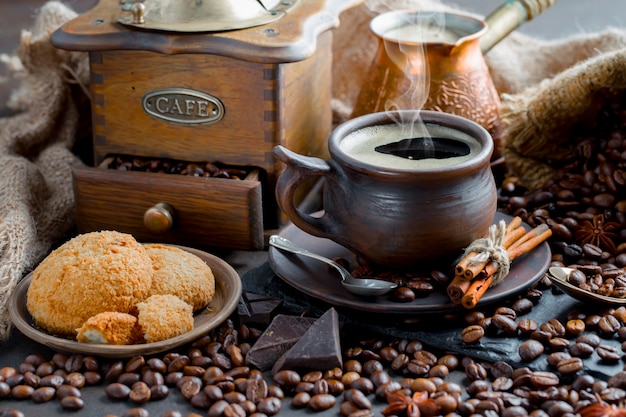 Coffee in a cup on coffee beans.