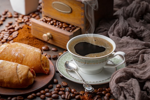 Coffee in a cup on coffee beans