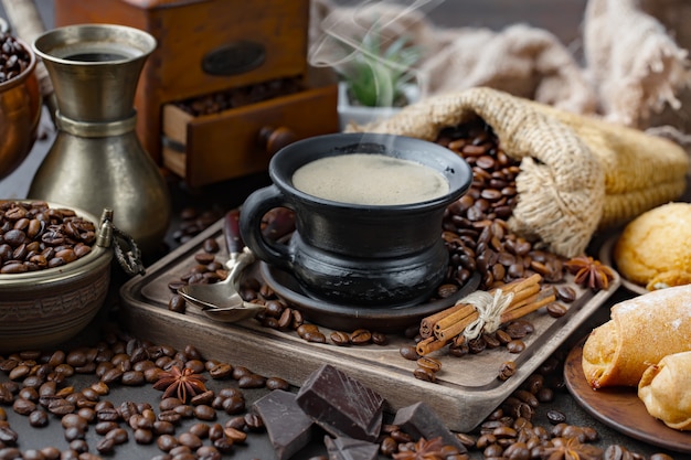 Coffee in a cup on coffee beans