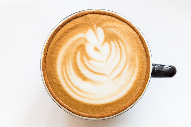 Photo coffee cup latte art on table