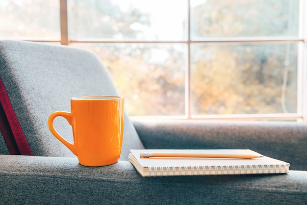 Coffee cup and notebook