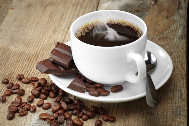 Coffee in a cup on an old background.