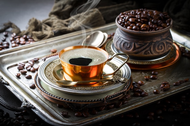 Coffee in a cup on an old table.