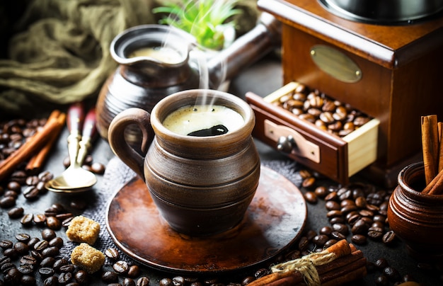 Coffee in a cup and saucer on an old background