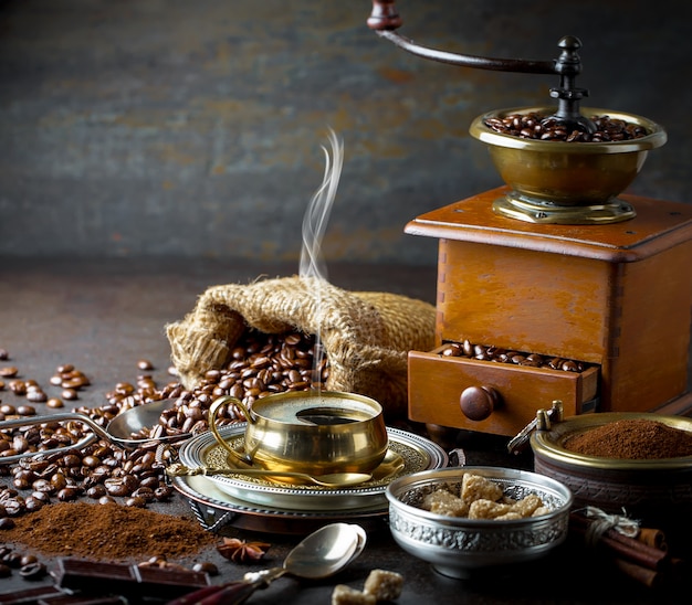 Coffee in a cup and saucer on an old background