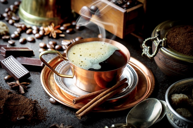 Coffee in a cup and saucer on an old background