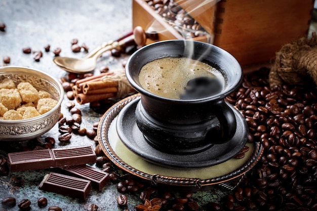 Coffee in a cup and saucer on an old background