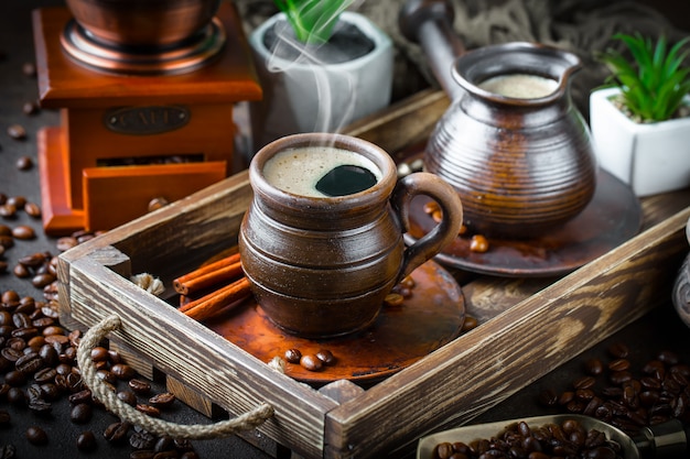 Coffee in a cup and saucer on an old background