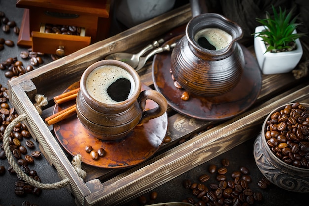 Coffee in a cup and saucer on an old background