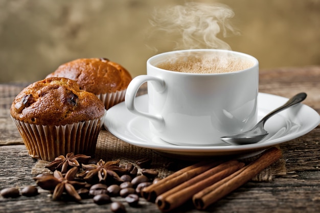 Coffee in a cup and saucer on an old space.