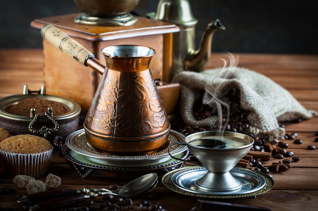 Coffee in a cup and saucer on an old.