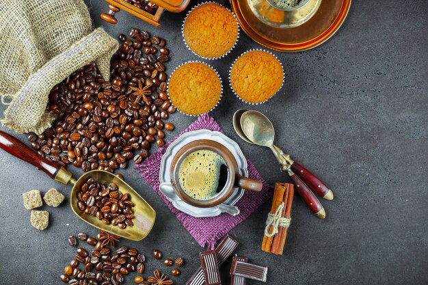 Coffee in a cup and saucer with coffee beans