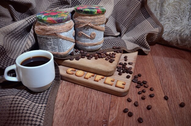 Coffee cup and a text, composed of crackers