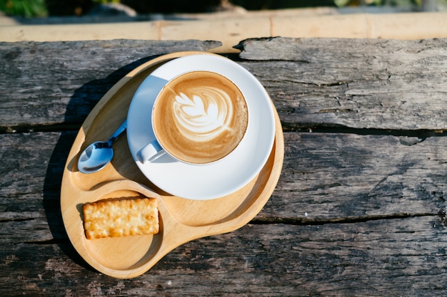 Coffee cup top view on wooden table background